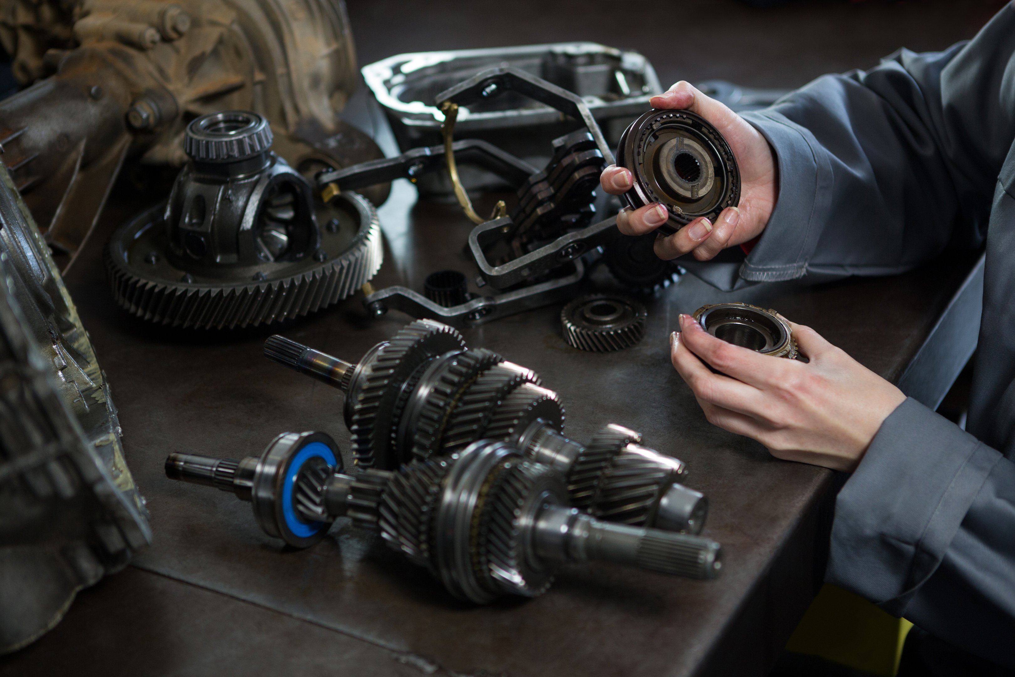 Female Mechanic Holding Spare Parts