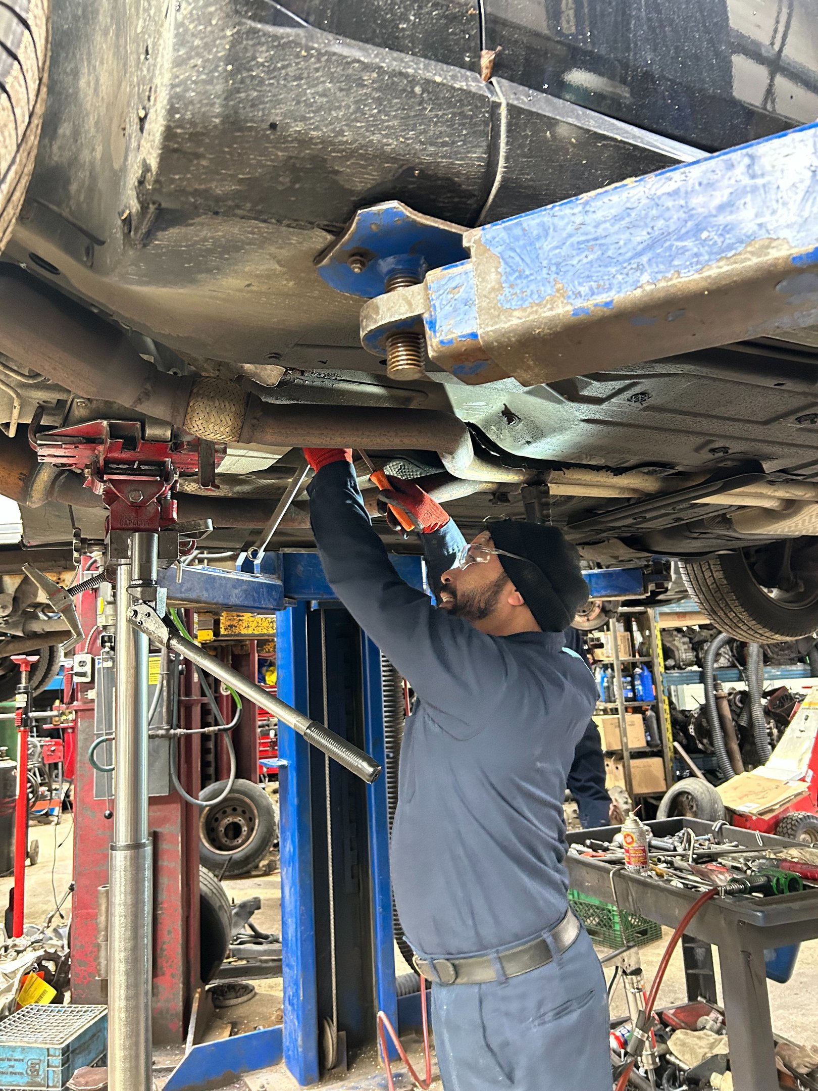 John working on mechanical parts